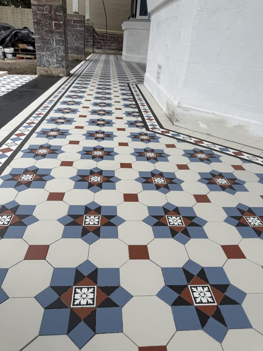 Blue and white Glasgow star verandah floor from a low angle, pattern filling the frame, Queens Park