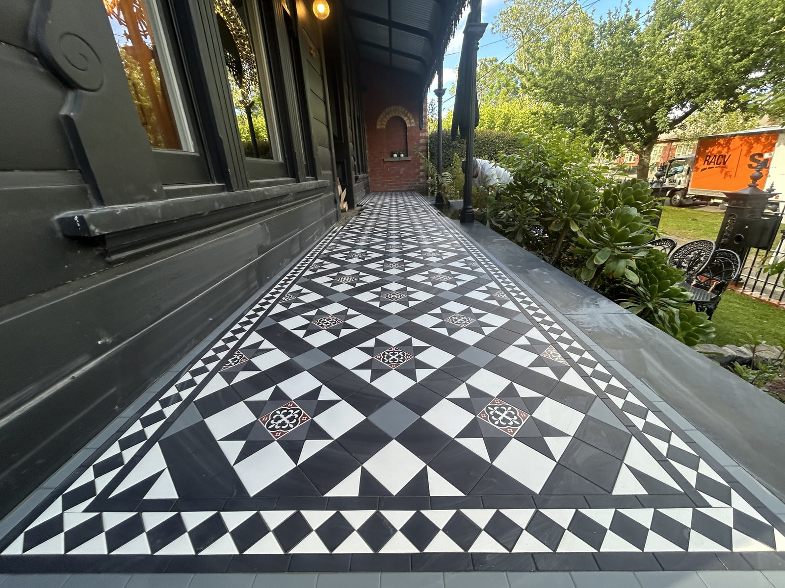 Long blue, black and white Paddington verandah with a Norwood border running past the front windows, Ballarat